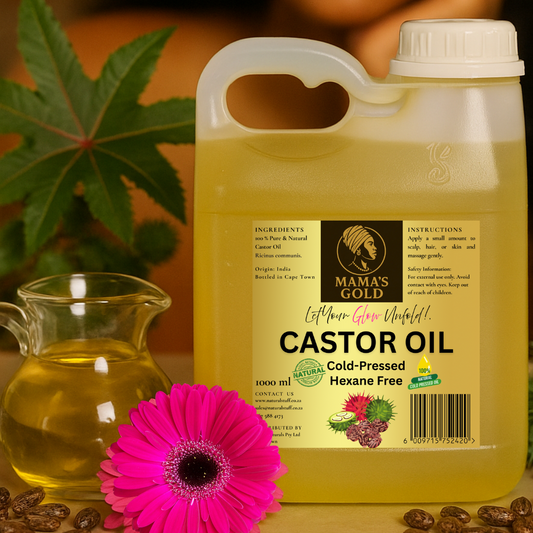 Mama's Gold castor oil container with a pink flower and leaves in the background
