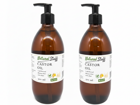 Two bottles of Natural Stuff Castor Oil on a white background