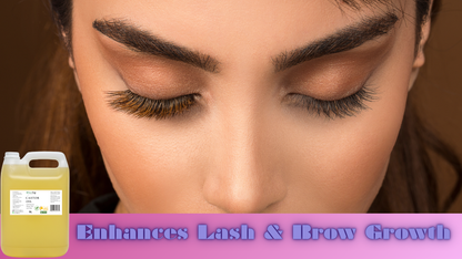Woman with long eyelashes and a bottle labeled 'Enhances Lash & Brow Growth' on a brown background