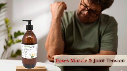 Bottle of Natural Stuffs Castor Oil with a man showing muscle tension on a white surface.