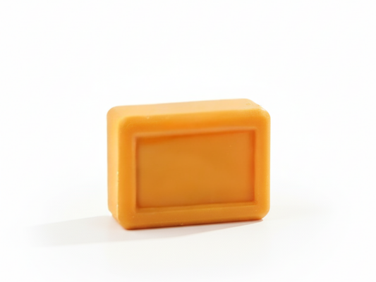 Orange rectangular bar of soap on a white background