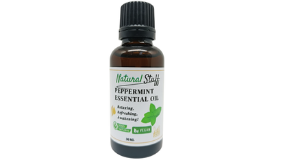 Bottle of peppermint essential oil on a white background