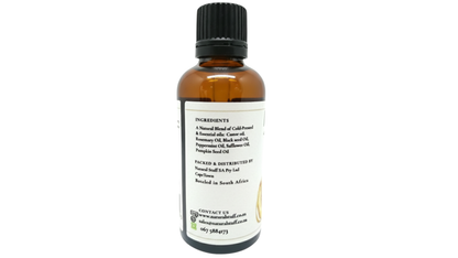 Bottle of essential oil with a white label on a white background