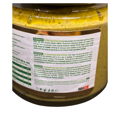 Close-up of a jar with a label on a white background