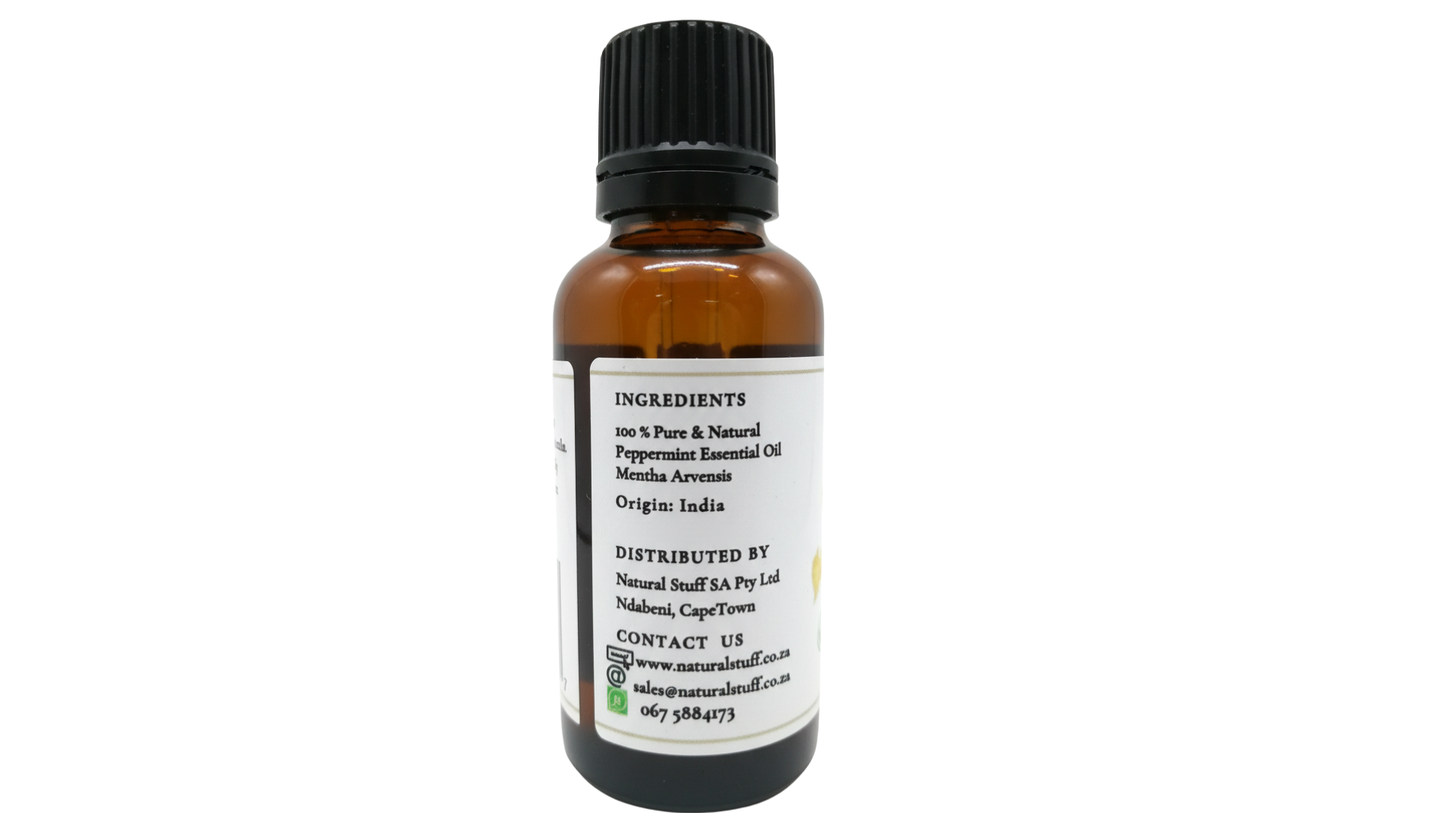 Bottle of essential oil with a label on a white background