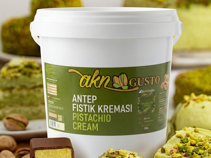 White bucket labeled 'akn Gusto' with pistachio cream product in the background