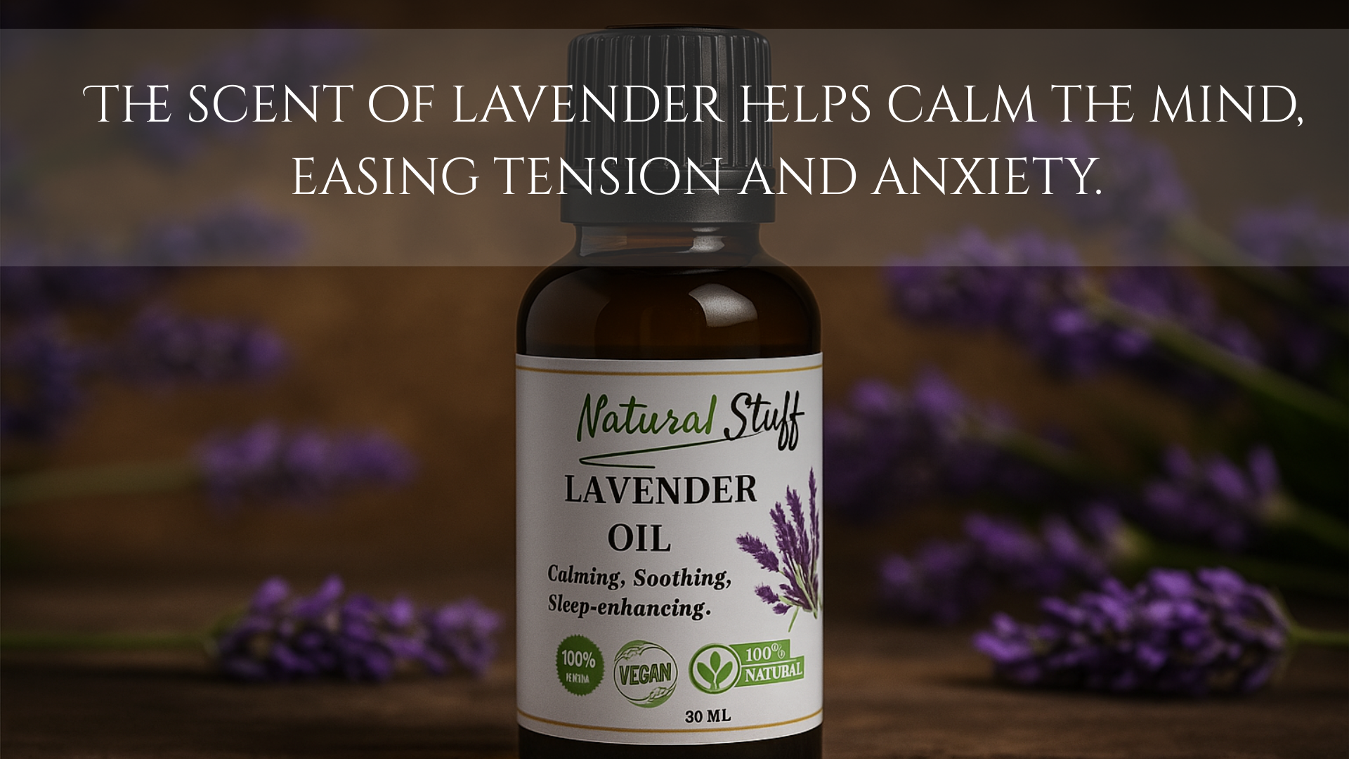 Bottle of Natural Stuff Lavender Oil with lavender flowers in the background