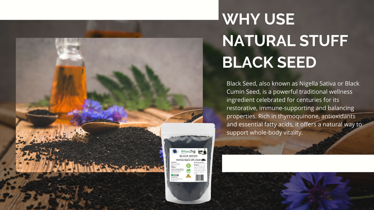 Black seed with a bottle of oil and herbs on a wooden surface, promoting natural wellness.