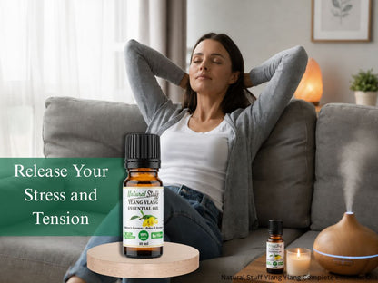 Woman relaxing on a couch with essential oil bottles and diffuser, promoting stress relief.
