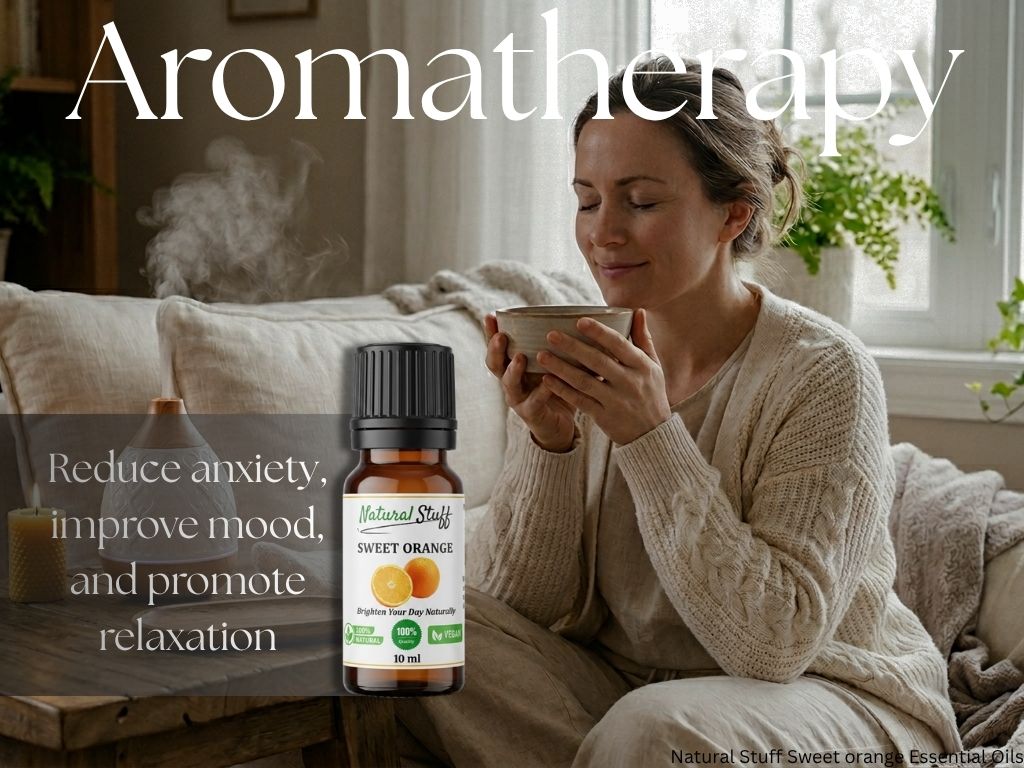 Woman holding a mug with an aromatherapy product bottle labeled 'Sweet Orange' on a table.