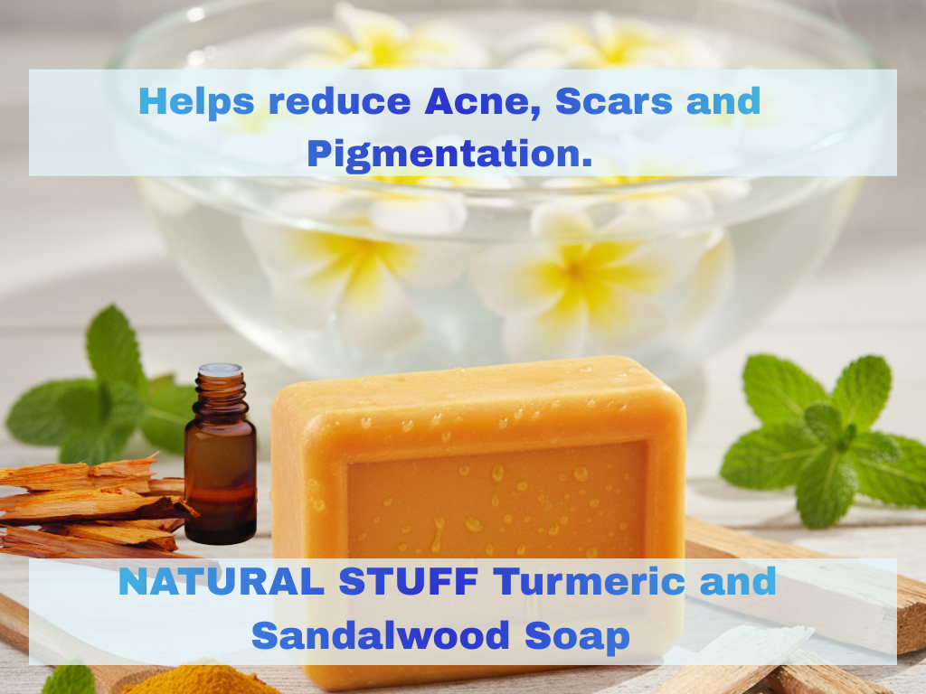 Natural Stuff Turmeric and Sandalwood Soap with a bottle of essential oil and herbs on a white background.