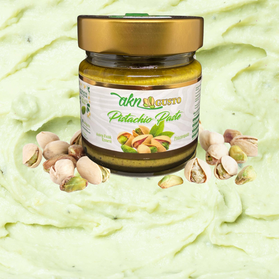 Jar of Takh Gusto Pistachio Paste on a green background with pistachios.