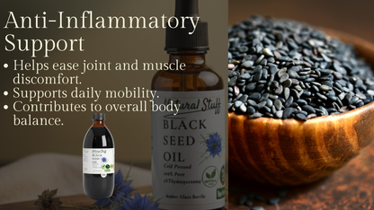 Black seed oil bottles with a bowl of black seeds on a wooden surface.