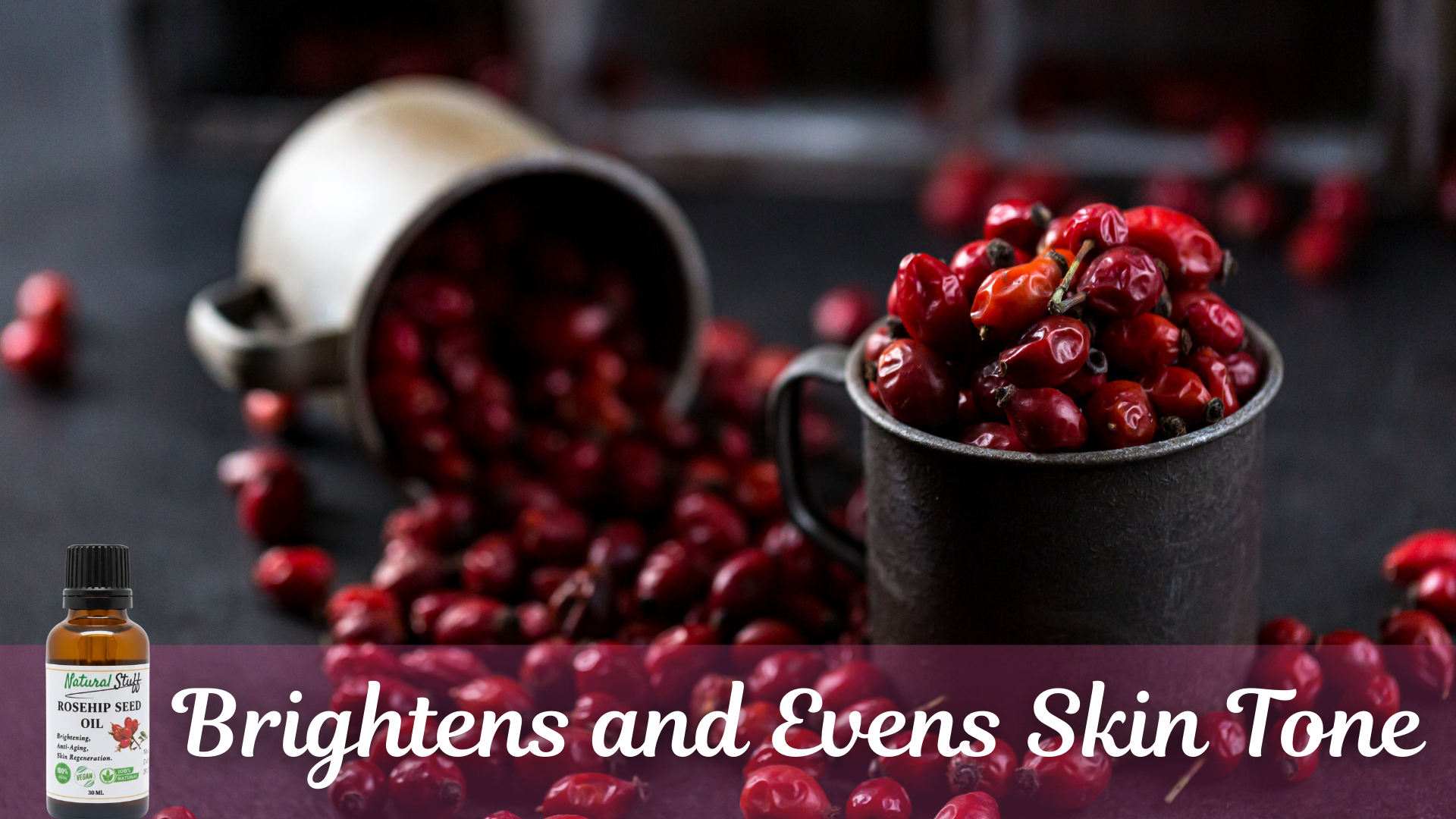 Red berries in a cup with a bottle labeled 'Brightens and Evens Skin Tone' on a dark background