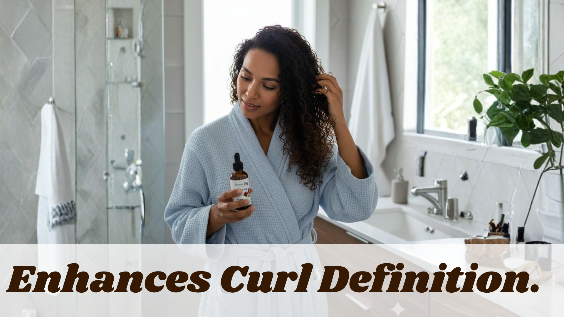Woman in a bathrobe holding a bottle of hair product in a bathroom.