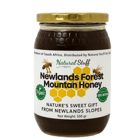 Jar of Newlands Forest Mountain Honey with a gold lid on a white background