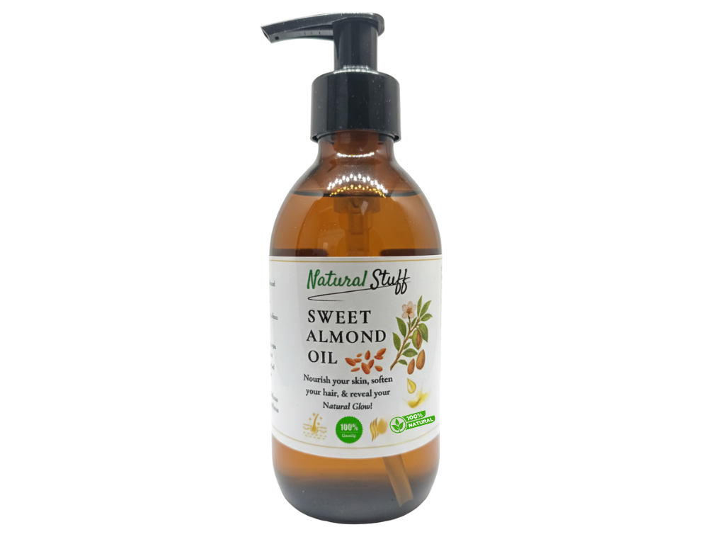 Bottle of sweet almond oil with a pump on a white background