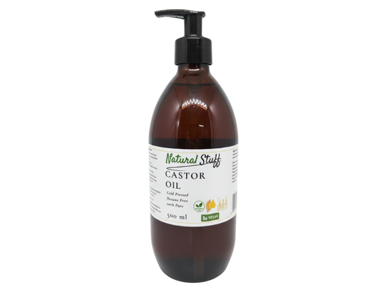 Brown bottle of castor oil with a pump on a white background