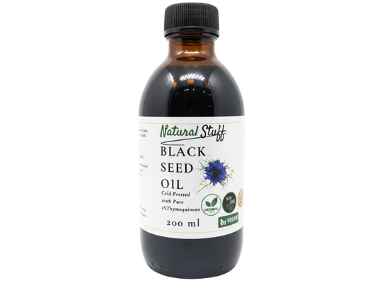 Bottle of Black Seed Oil with a label on a white background