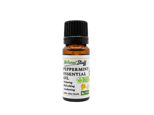 Bottle of peppermint essential oil with a white label on a white background